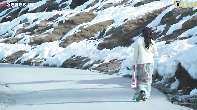 Indian bhabhi in floral skirt walks on snowy path, sexy winter tease