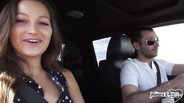 Dani Daniels smiles in car with James Deen driving in desert