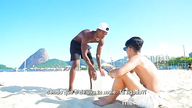 Two hot Brazilian boys on beach, one squatting nude with big dick