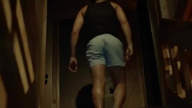 Andrea Del Rosario muscular back view in tight shorts walking
