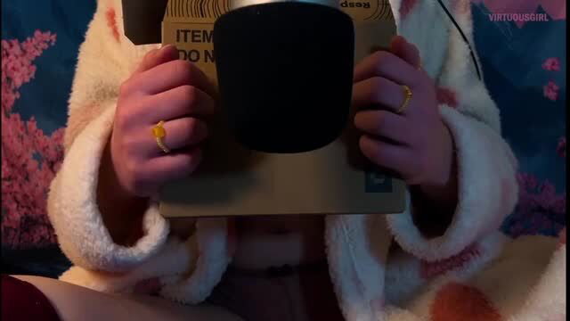 Solo girl in white robe holding black microphone ASMR relaxation trigger