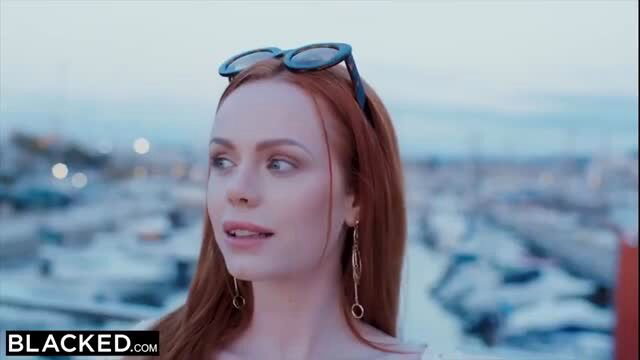 Redhead Ella Hughes in outdoor scene with marina background