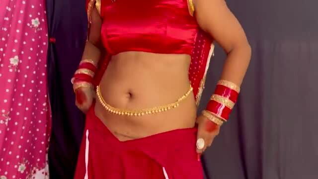 Mornikumari in red saree blouse with gold belly chain