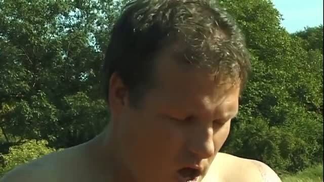 Shirtless muscular man outdoors with open mouth, close-up face and chest