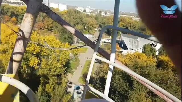 Blowjob on Ferris wheel looking down at park, public exhibitionist sex