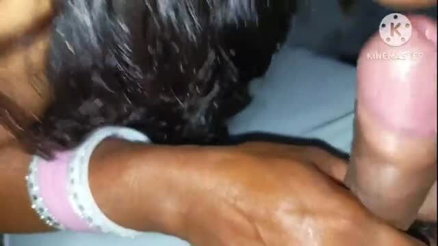 Close-up of dark hair, cock and hand with bracelet receiving oral