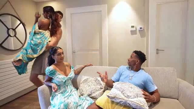 Yasmina Khan in turquoise dress with Jesus Reyes in interracial group scene