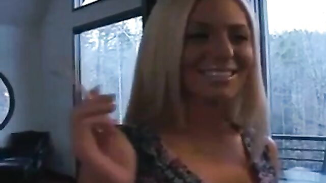 Blonde bombshell Brandy smoking seductively in revealing top