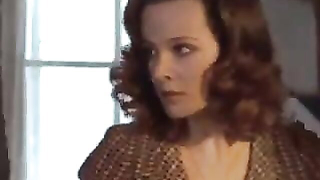 Laura Antonelli in vintage Malizia closeup, seductive gaze in sexy dress