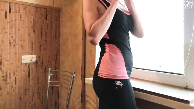 Slim Russian amateur babe in tight Nike leggings poses sexy side view
