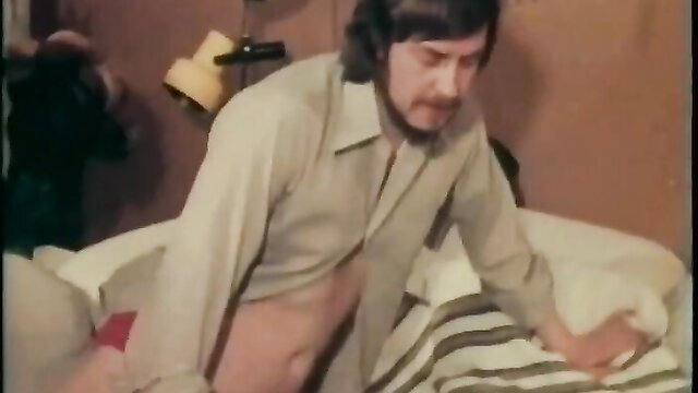 Vintage bearded man in open shirt undressing woman in bed