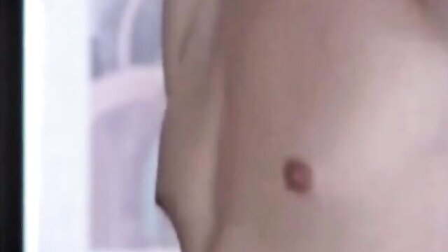 Vintage Expo Film 105 closeup of nude woman's natural tits and hairy pussy