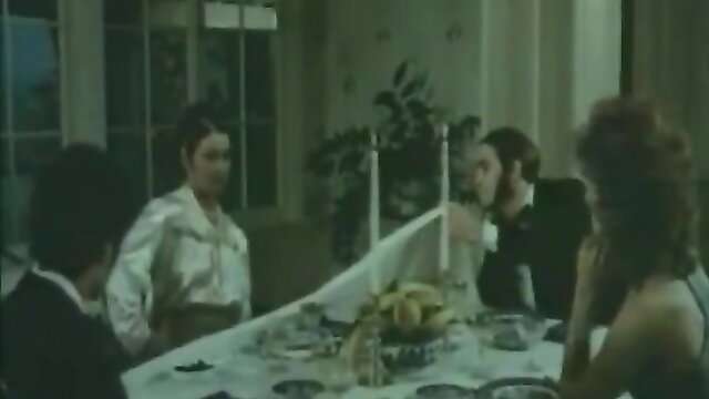 Vintage 70s dinner table orgy with curly haired women and suited men