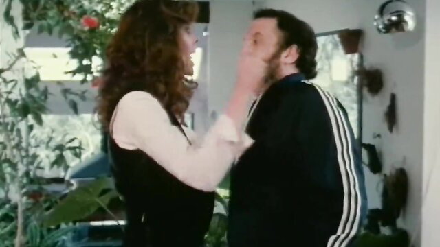 Kay Parker grabs face of man in vintage porn scene with Honey Wilder