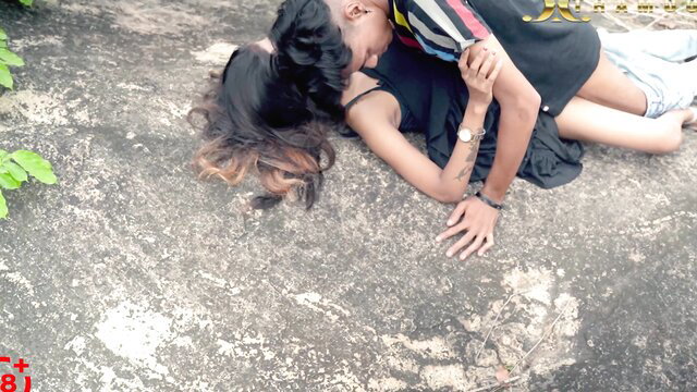 Hot Desi couple outdoor makeout, girl in black dress on rock