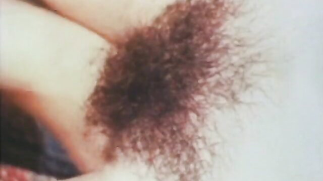 Vintage closeup of slim brunette's hairy pussy in punishment scene