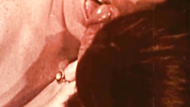 Vintage closeup of woman's ear and pearl earring in hot classic porn