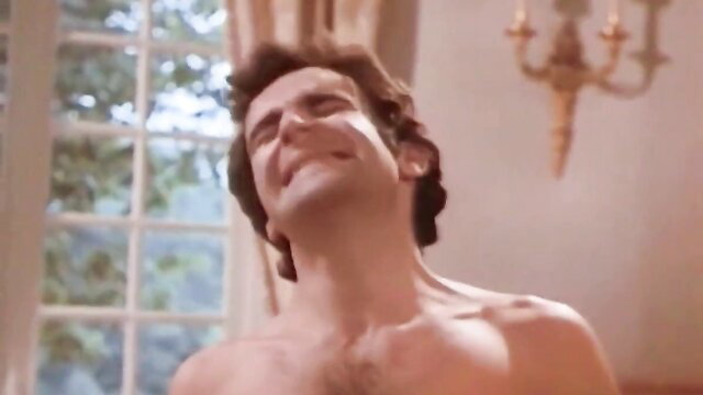 Vintage hairy chested man laughing nude in luxurious room