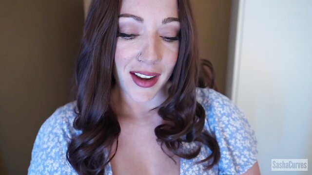 SashaCurves busty stepmom in low-cut floral top smiling seductively