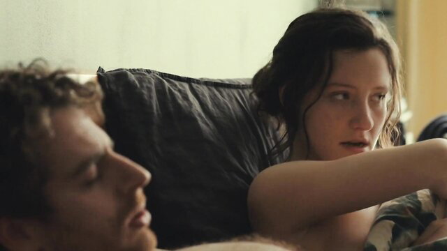 Amel Charif topless in bed with man in À la joie (2023)