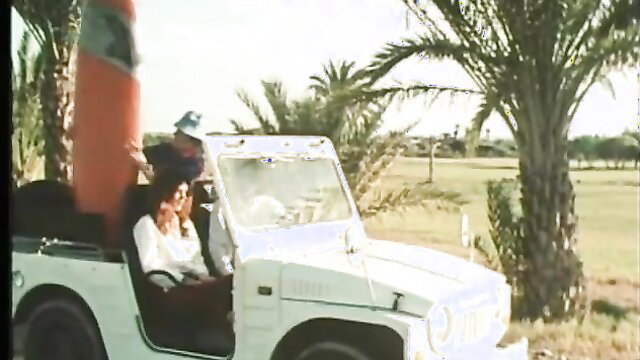 Vintage blonde in white jeep under palms, Ribu Aristokrat 21 ecstasy