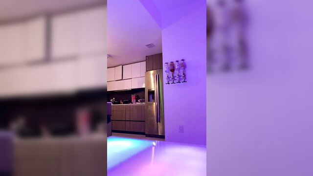 Zen Mami Live in neon-lit kitchen, sexy pose in modern home