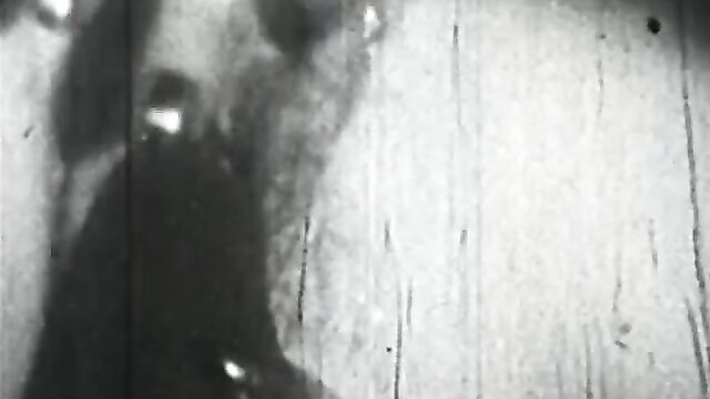 Vintage French stag film thumbnail: shadowy nude woman shaving pussy closeup