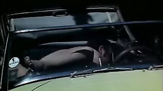 Vintage black man nude in car, leaning back exposing body