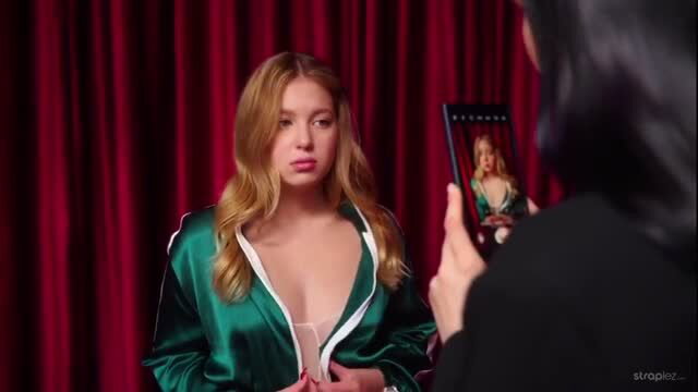 Curvy blonde teases big tits in open satin jacket on stage