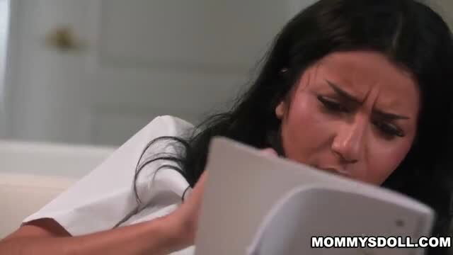 Roxie Sinner in Homework Interrupted, brunette babe looking upset while reading