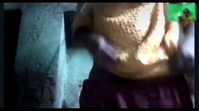 Indian woman in gold blouse and saree exposing midriff