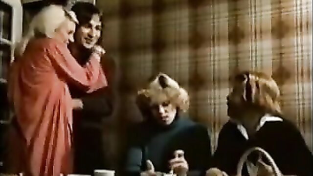 Vintage 70s blonde milf embraces shaggy haired guy with two women