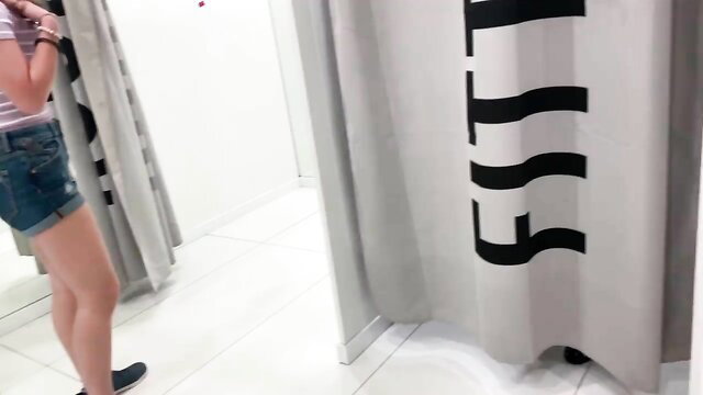 Hot teen in shorts at fitting room, risky changing room tease