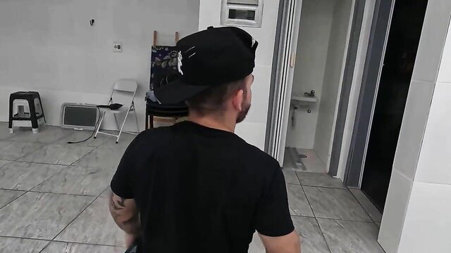 Ma Santos in black cap and tee at Brazilian mansion party