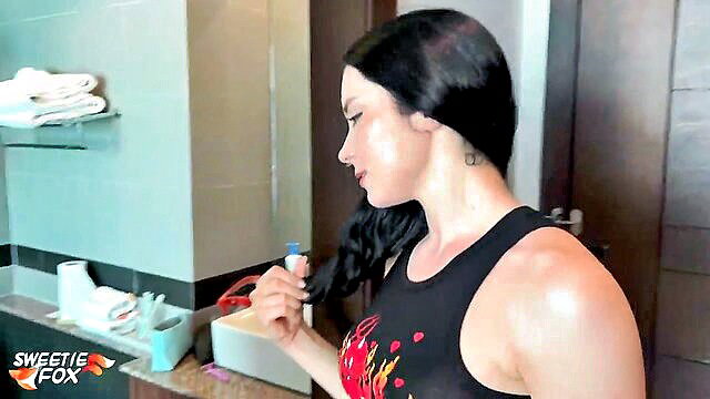 Hot tattooed brunette neighbor in tank top holds toothbrush POV bathroom tease