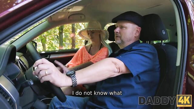 Mature man drives with hot blonde MILF in orange top and hat in car