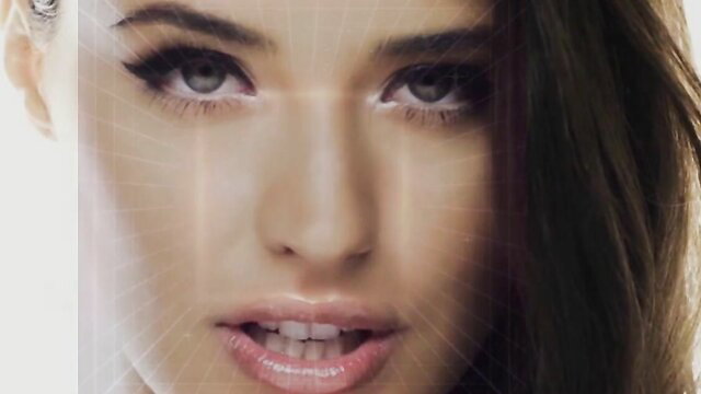 Stunning brunette beauty with glossy lips and smoky eyes closeup