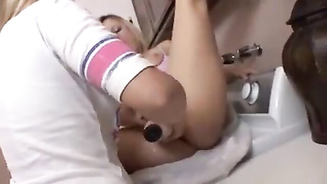 Nerdy Asian girls scissoring passionately in bathroom lesbian sex