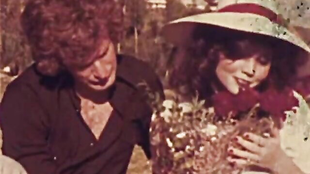 Kandi Barbour and Paul Thomas romantic outdoor embrace with flowers