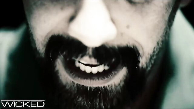 Derrick Pierce grinning intensely close-up in adult video thumbnail