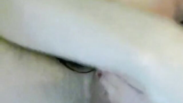 Closeup of cute girl's plump lips and eye blowing man on cam