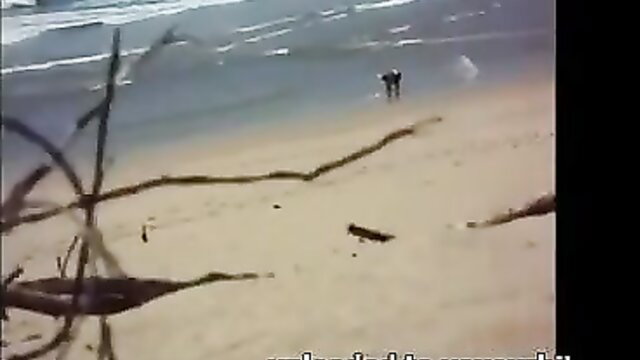 Moroccan beach voyeur couple walking nude on sandy shore