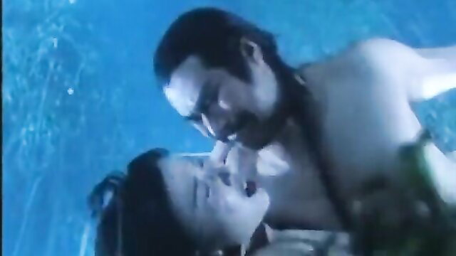 Asian couple underwater kung fu sex scene with intense embrace