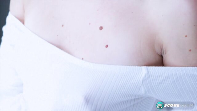 Mackenzie Mace cleavage in tight white top, freckles on pale tits