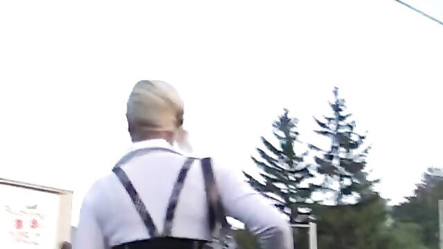 Blonde mature man in suspenders walks away outdoors, schoolgirl tease thumbnail