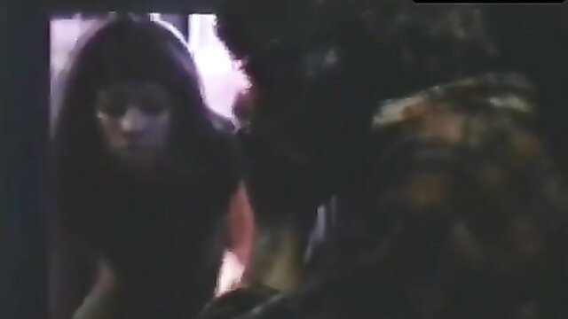 Diana Doll cleavage in Night Of The Juggler scene