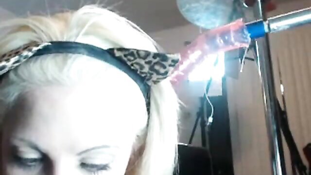 Blonde girl with leopard headband deepthroats huge dildo fully