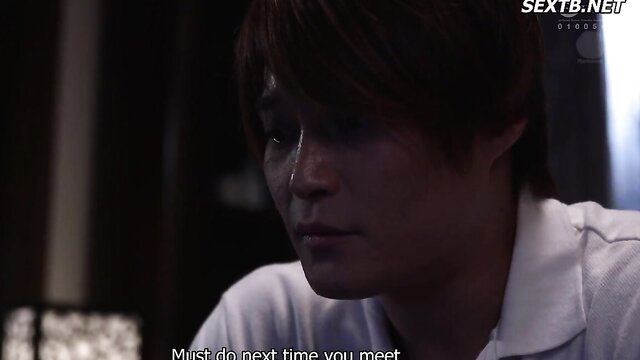 Handsome Asian man with tears, intense gaze in JAV scene