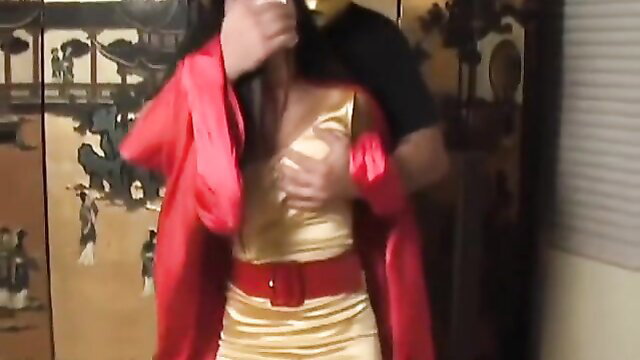 Asian superheroine in gold dress groped by man in red coat BDSM tease