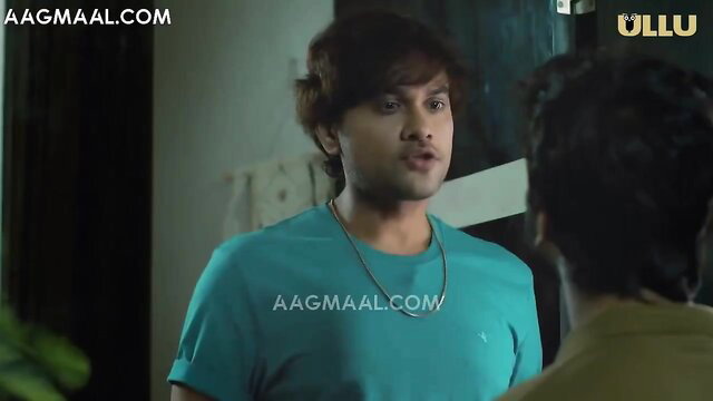 Two young Indian guys in casual shirts talking intimately, Ullu web series scene